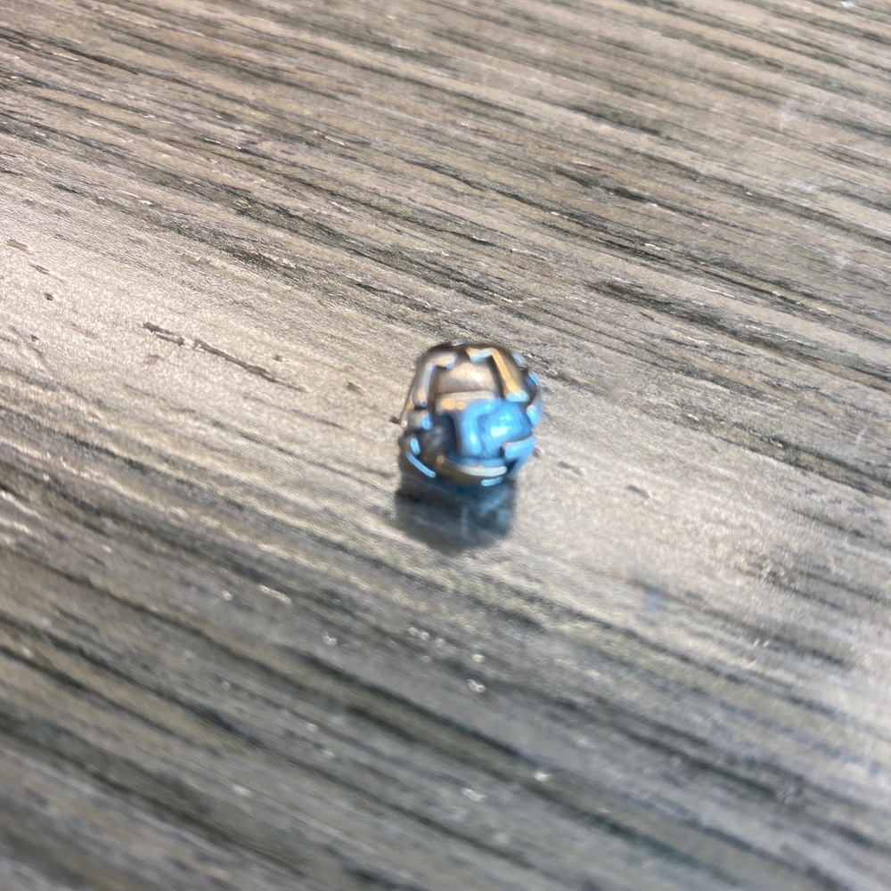 Pandora round Initial charm T
